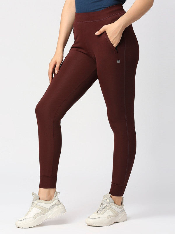 Women Wine Solid Joggers - ZIP TRACK DRYKNIT-WN-Lovable India